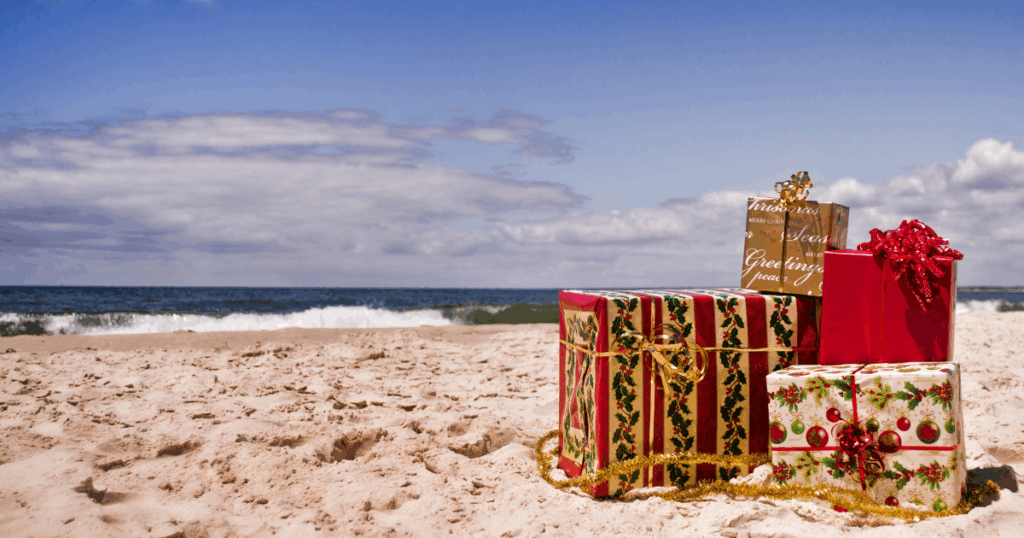 wrapped christmas presents on beach