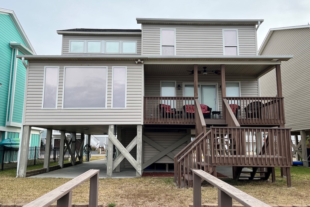 Vacation rental exterior view showing canal-facing balcony.
