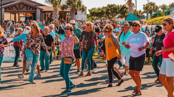 Crowd dancing to live music | Williamson Realty Ocean Isle Beach Vacation Rentals