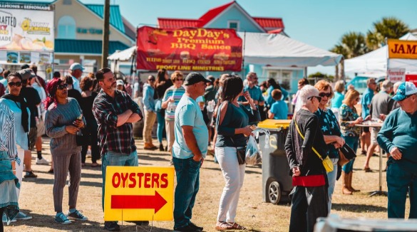 Crowd lined up and waiting for oysters | Williamson Realty Ocean Isle Beach Vacation Rentals