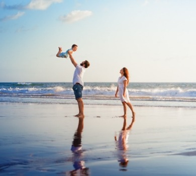 family enjoying the beach | Williamson Realty
