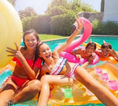 children playing in swimming pool | Williamson Realty