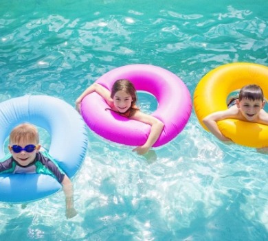 children playing in swimming pool floats | Williamson Realty