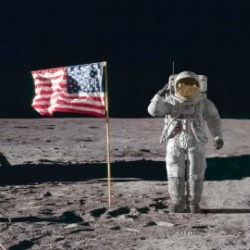 Astronaut saluting on the moon with American flag | Williamson Realty Ocean Isle Beach Vacation Rentals