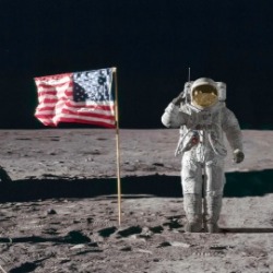 Astronaut saluting on the moon with American flag | Williamson Realty Ocean Isle Beach Vacation Rentals