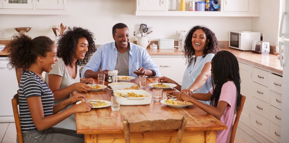 family eating together at their vacation rental | Williamson Realty