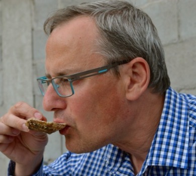 man eating oyster | Williamson Realty