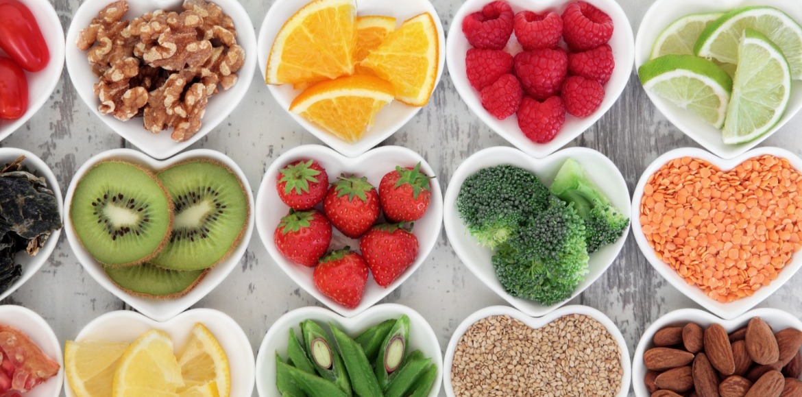 variety of healthy foods in heart shaped bowls | Williamson Realty