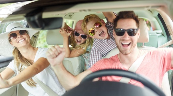 family in car listening to music | Williamson Realty