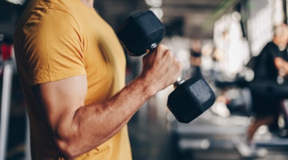 man lifting weights | Williamson Realty