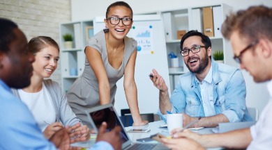 happy employees working together | Williamson Realty