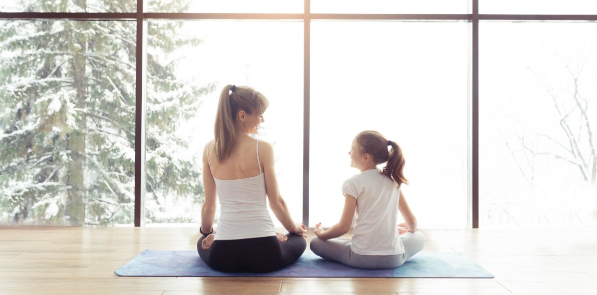 mother daughter doing yoga | Williamson Realty Vacations
