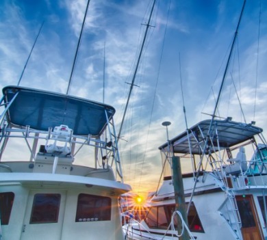 Charter fishing boats in a marina  | Williamson Realty Vacations Ocean Isle Beach Vacation Rentals