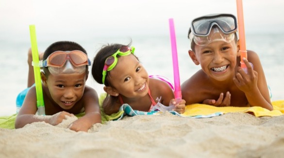children smiling on ocean isle beach | Williamson Realty Vacations