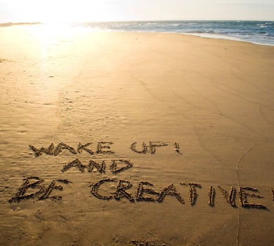 wake up and be creative written in sand on beach | Williamson Realty Vacations