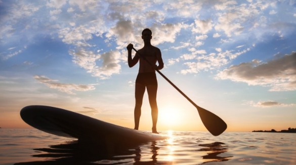 paddleboarding on ocean isle beach | Williamson Realty