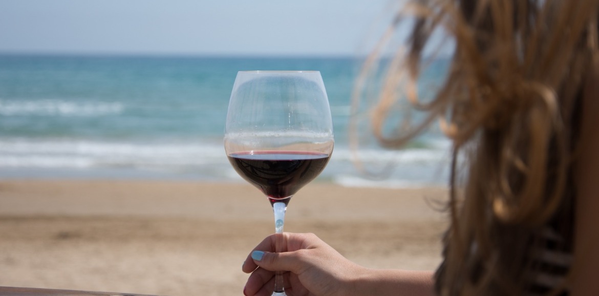 drinking wine on ocean isle beach | Williamson Realty Vacations