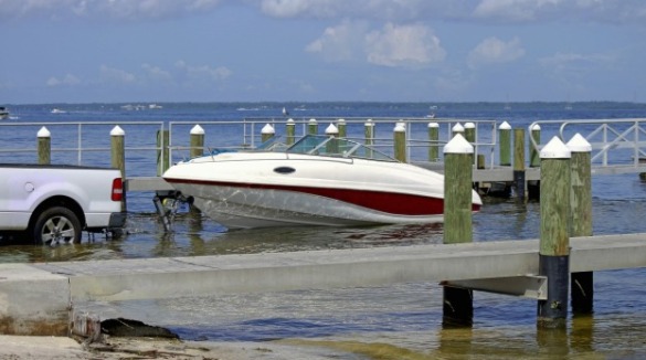 truck unloading boat at boat ramp | Williamson Realty